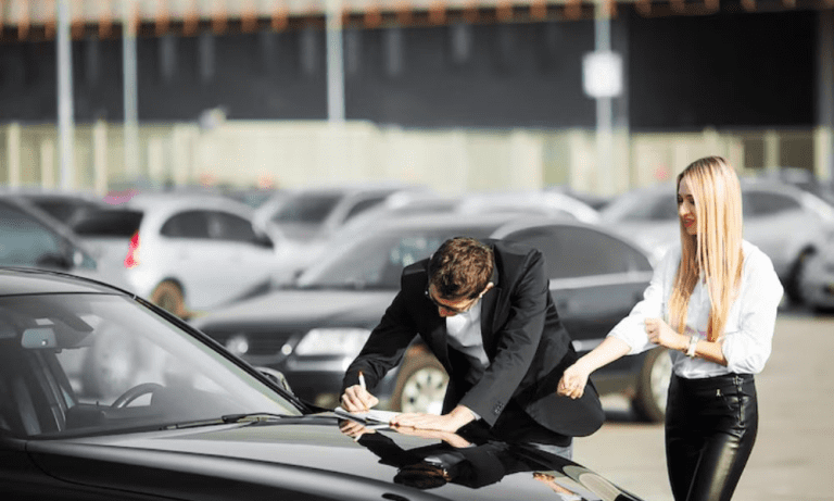 A car buyer and a seller finalizing a car export agreement in a parking lot, with focus on secure car purchase for export.