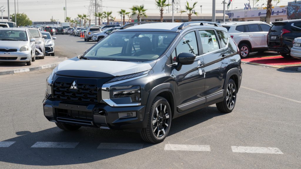 Mitsubishi Premium Xpander Cross 2026 Grey Burgundy Black Front Quarter View 1024x576