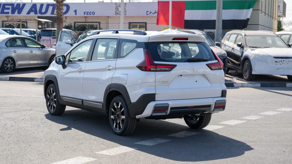Mitsubishi Premium Xpander Cross 2026 White Burgundy Black Rear Side Angle View 1024x576