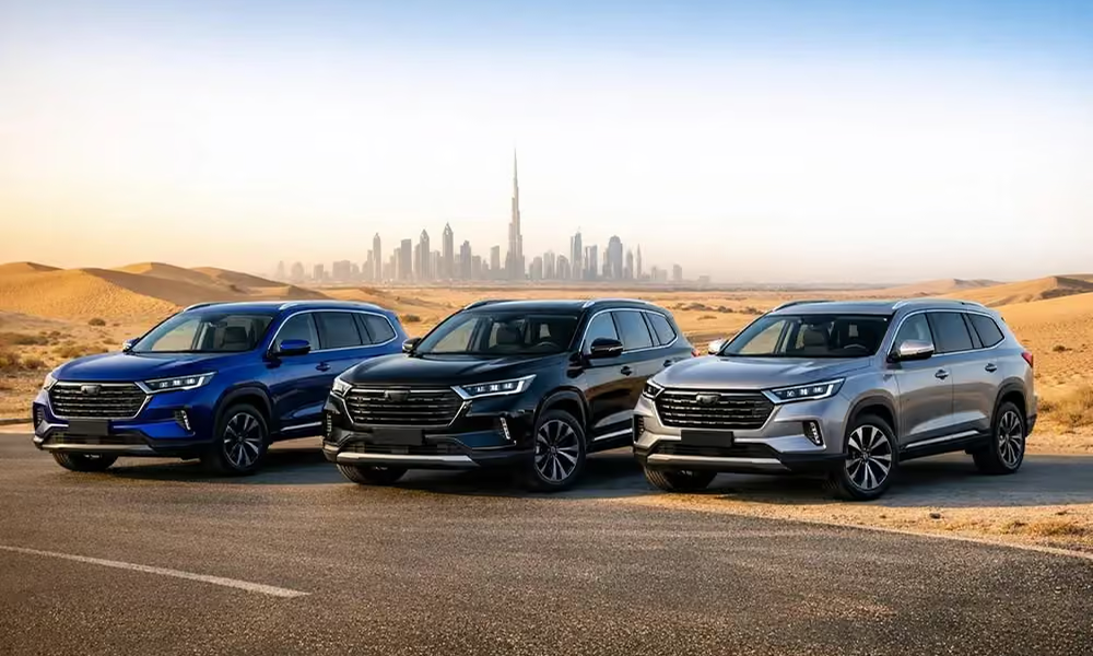 Three 7-seater SUVs on a Dubai road with the city skyline in the background