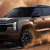 Mitsubishi 2027 SUV model for export from Dubai driving through desert terrain